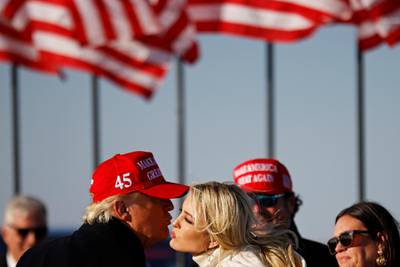 US President Donald Trump kisses his daughter Ivanka at the end of a campaign rally at Dubuque Regional Airport in Dubuque, Iowa, US. Reuters