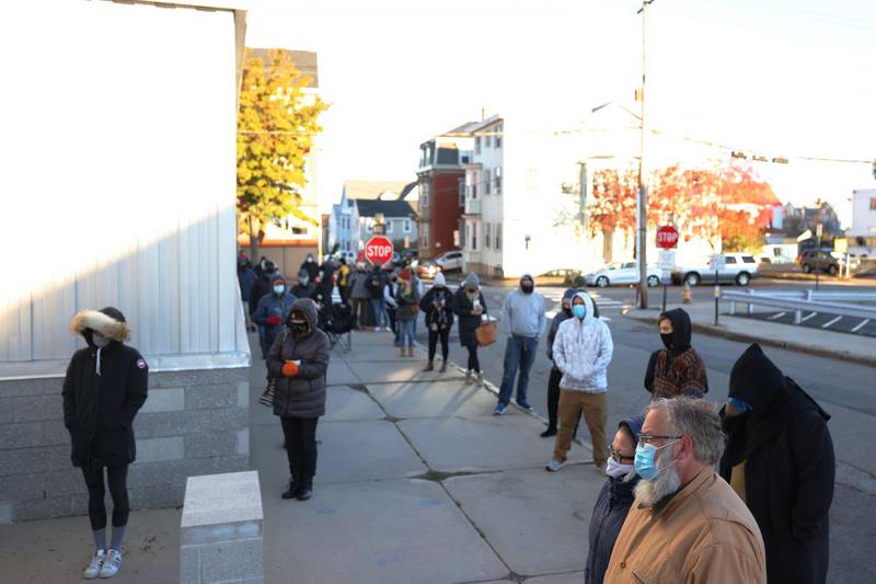 People wait in line to vote in Portland, Maine. AFP