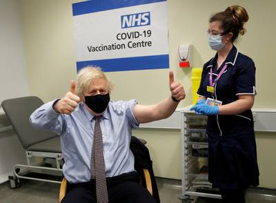 British Prime Minister Boris Johnson reacts after receiving a dose of the AstraZeneca vaccine in London. Reuters