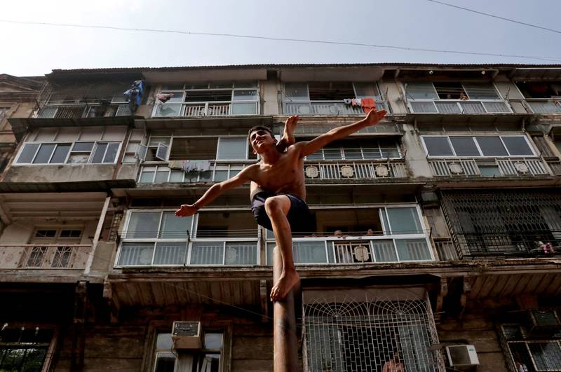 A boy performs traditional Indian malkhamb gymnastics during the Gudi Padwa festival, which celebrates the beginning of the new year for Maharashtrians, in Mumbai. Reuters