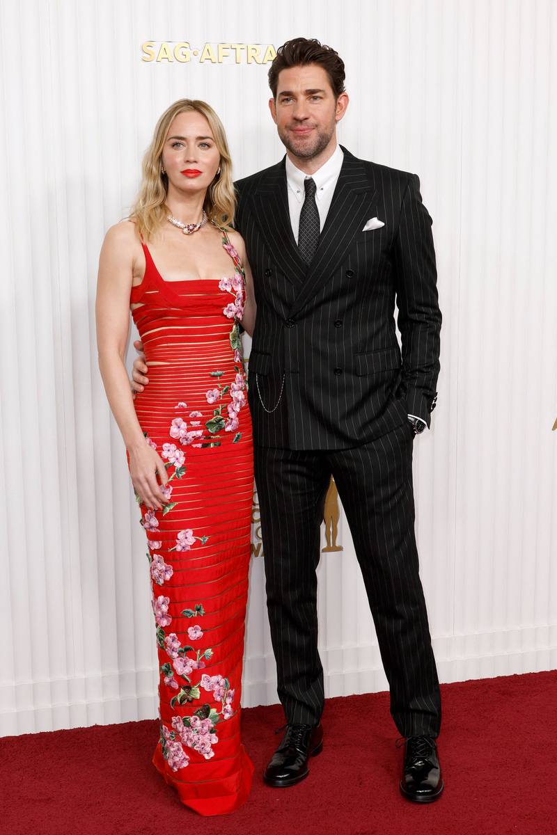 Emily Blunt wears Oscar de la Renta and her husband, John Krasinski, wears Dolce & Gabbana. AFP