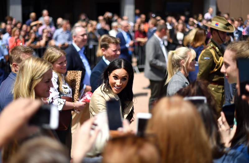 Meghan smiles as she meets with people outside the Sydney Opera House. AFP