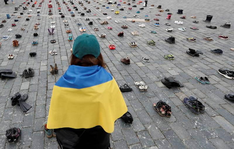 Shoes in Prague's Old Town Square symbolise alleged war crimes against Ukrainian civilians on the first anniversary of Russia's invasion. Reuters
