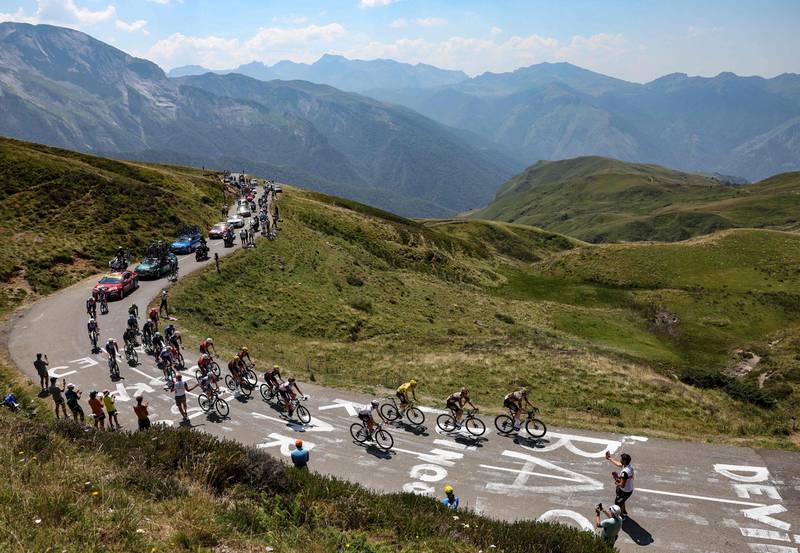 Riders including Jonas Vingegaard and Tadej Pogacar on the Col de Spandelle. AFP