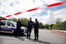 French police officers block the road leading to a crime scene the day after a knife-wielding attacker stabbed to death a senior police officer and his female companion Monday evening in Magnanville, west of Paris, France,on June 14, 2016. AP Photo