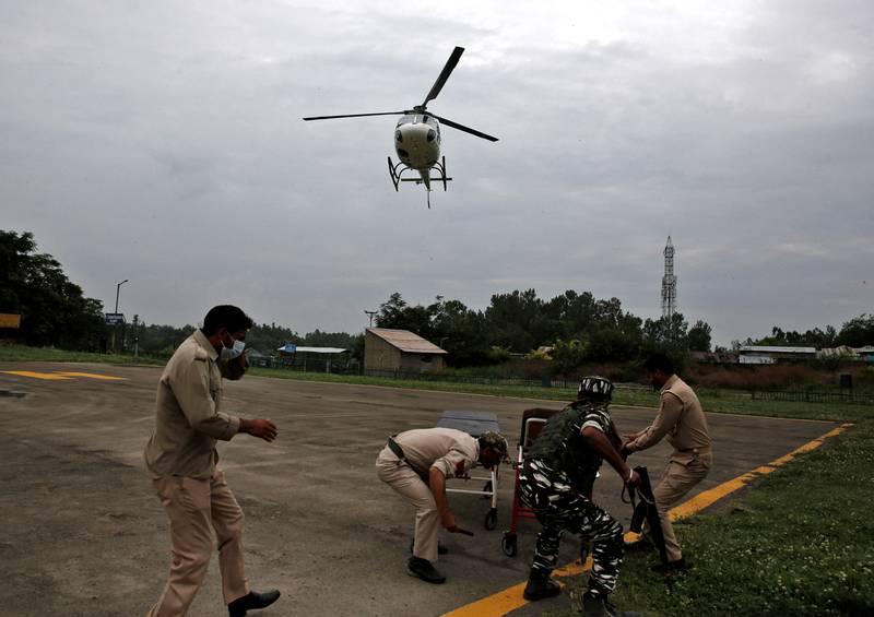 A helicopter arrives to carry injured people to hospital. Reuters / Danish Ismail