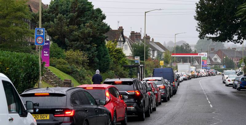 Long queues have formed at petrol stations across the UK. PA