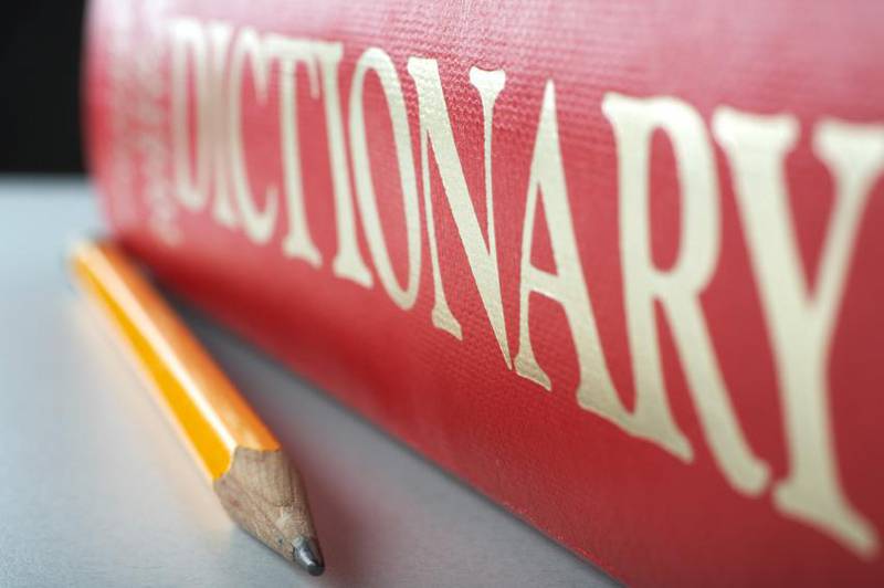 Dictionary and pencil.  Selective focus on the pencil tip. (iStockphoto.com)