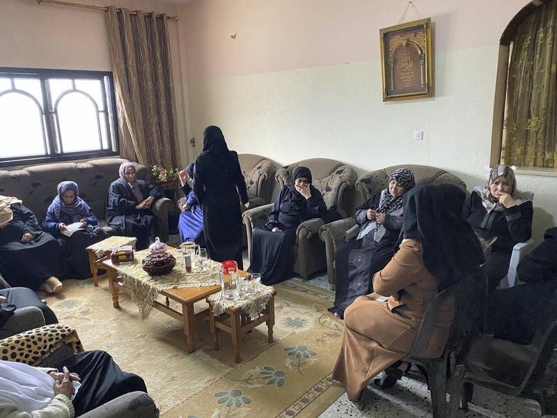 Mirvat, Mohammed Al-Na'em's mother surrounded by women at son's funeral