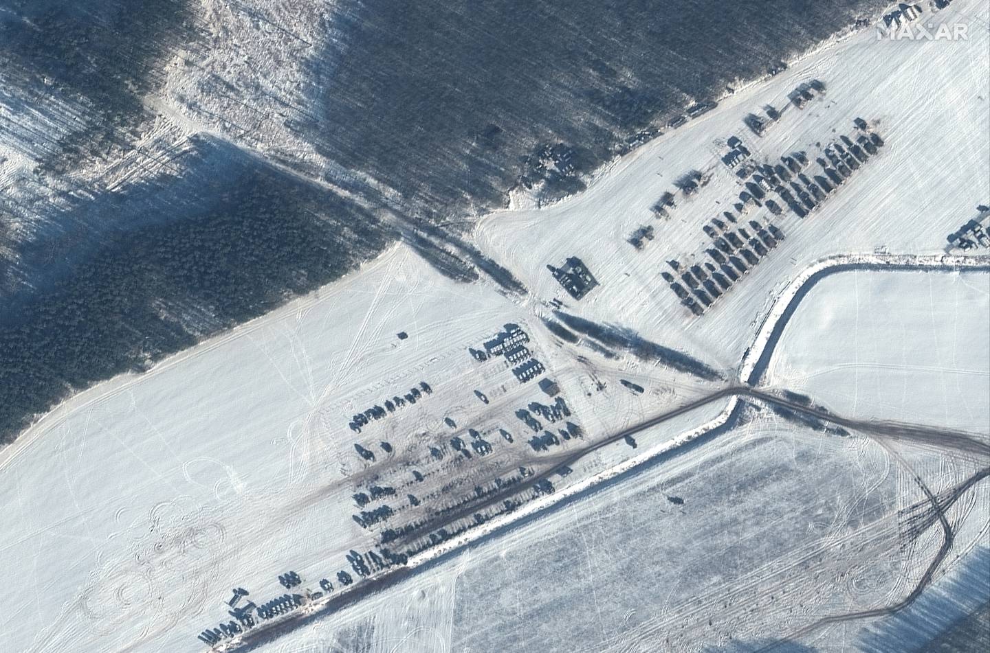 A satellite image from Maxar Technologies shows troops and equipment in Rechitsa, Belarus, north of the border with Ukraine. AP