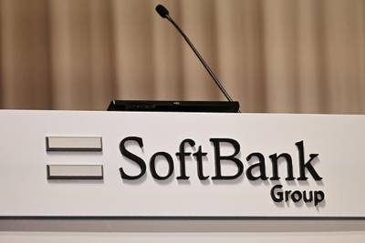 (FILES) This file photo taken on May 9, 2019 shows the Softbank Group logo on a podium during a press conference to announce the company's financial results in Tokyo. Japan's SoftBank Group on July 26, 2019 announced a new 108-billion USD investment fund, the long-mooted successor to its blockbuster Vision Fund, with partners including Apple and Microsoft. / AFP / Charly TRIBALLEAU
