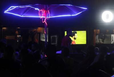 Egyptian soccer fans watch Liverpool's Egyptian forward Mohamed Salah during his World Cup qualifiers match between Egypt and Gabon on a screen at a cafe in Cairo, on September 5. Reuters