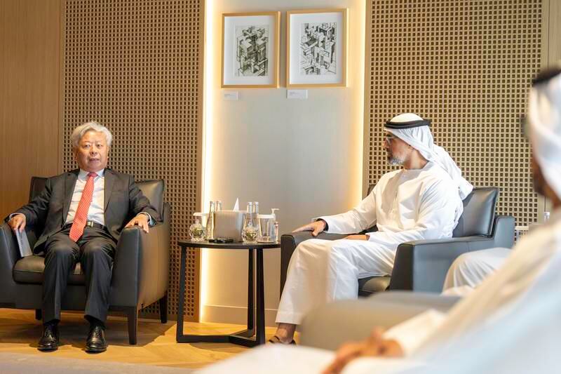 Sheikh Khaled bin Mohamed and Jin Liqun.  Photo: Abu Dhabi Government Media Office