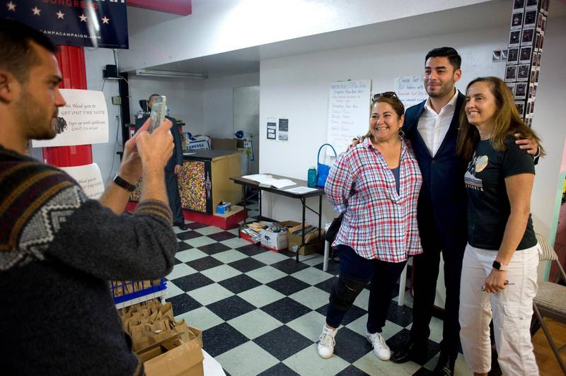 Ammar Campa-Najjar, candidate for US Congress, CA 50th District, poses for photographs with supporters before they begin to canvass houses at campaign headquarters in Escondido, California. EPA