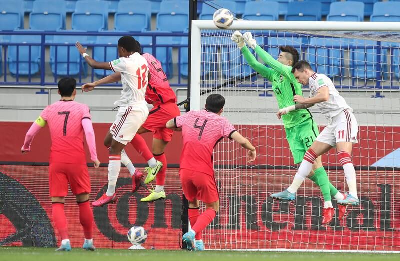 UAE attacker Caio Canedo fouls South Korea goalkeeper Jo Hyeon-woo. AP