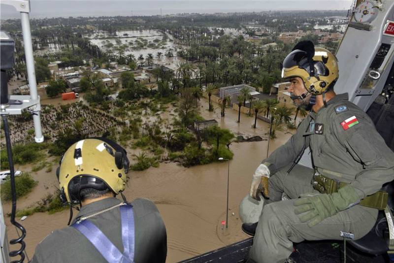 An Oman Air Force helicopter flies over Khaburah in Al Batinah district to assess damage caused by Cyclone Shaheen in October 2021. The government later said $500 million was required to repair infrastructure and homes. Photo: AP