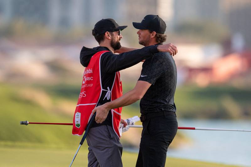 Thomas Pieters celebrates with his caddie Adam Marrow after his victory. AFP