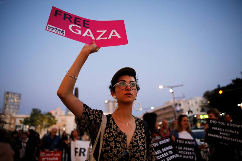 A protester holds a placard calling for a boycott of the 2019 Eurovision Song Contest. Reuters