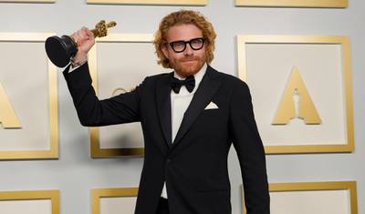 Best Cinematography: Erik Messerschmidt, for 'Mank', poses in the press room at the Oscars on Sunday, April 25, 2021, at Union Station in Los Angeles. AP Photo