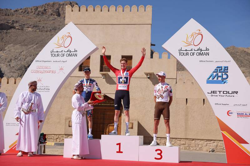 US Matteo Jorgenson of Movistar Team (C), poses on the podium with Belgian Mauri Vansevenant of Soudal Quick-Step (L) and French Geoffrey Bouchard of Ag2R Citroen Team (R), after winning the 2023 Oman Tour during its fifth stage, from Samail Al Fayhaa Resthouse to Jabal Al Akhdhar (Green Mountain). AFP