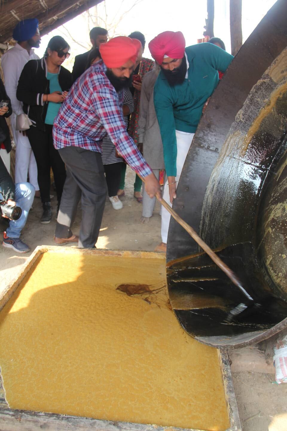 Jaggery being made from sugarcane pulp in a village in Punjab, India. Kalpana Sunder for The National 