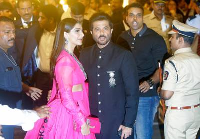Bollywood actor Anil Kapoor and his daughter Sonam Kapoor arrive to attend the wedding. AP Photo