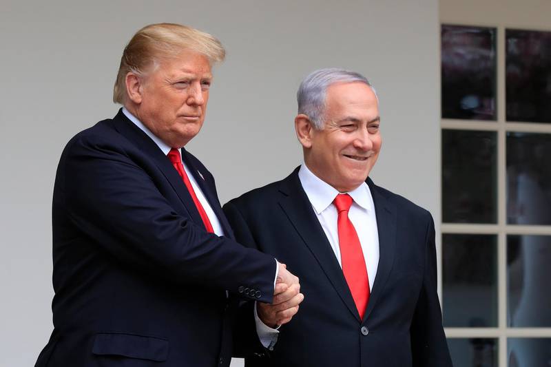 FILE - In this March 25, 2019 file photo, President Donald Trump welcomes visiting Israeli Prime Minister Benjamin Netanyahu to the White House in Washington.  Netanyahu, locked in a razor tight race and facing the likelihood of criminal corruption charges, a decisive victory in Tuesday, Sept. 17, vote may be the only thing to keep him out of the courtroom.  (AP Photo/Manuel Balce Ceneta, File)