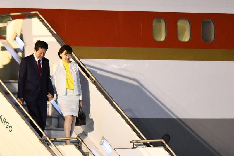 Prime Minister of Japan Shinzo Abe and his wife Akie arrive at Ministro Pistarini International Airport. Getty Images