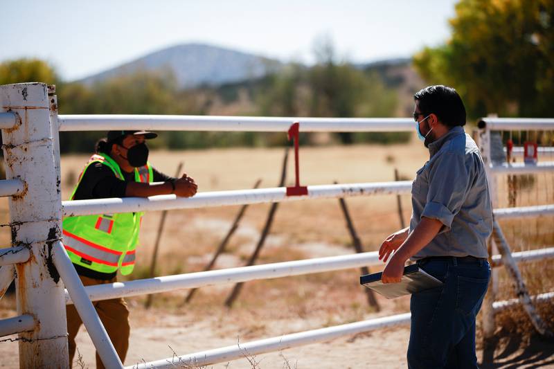A security guard speaks with a compliance officer from the State of New Mexico at the Bonanza Creek Ranch where 'Rust' was being filmed. AFP