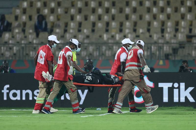 Burkina Faso goalkeeper Herve Kouakou Koffi is carried off after his collision with Cheikhou Kouyate. AFP