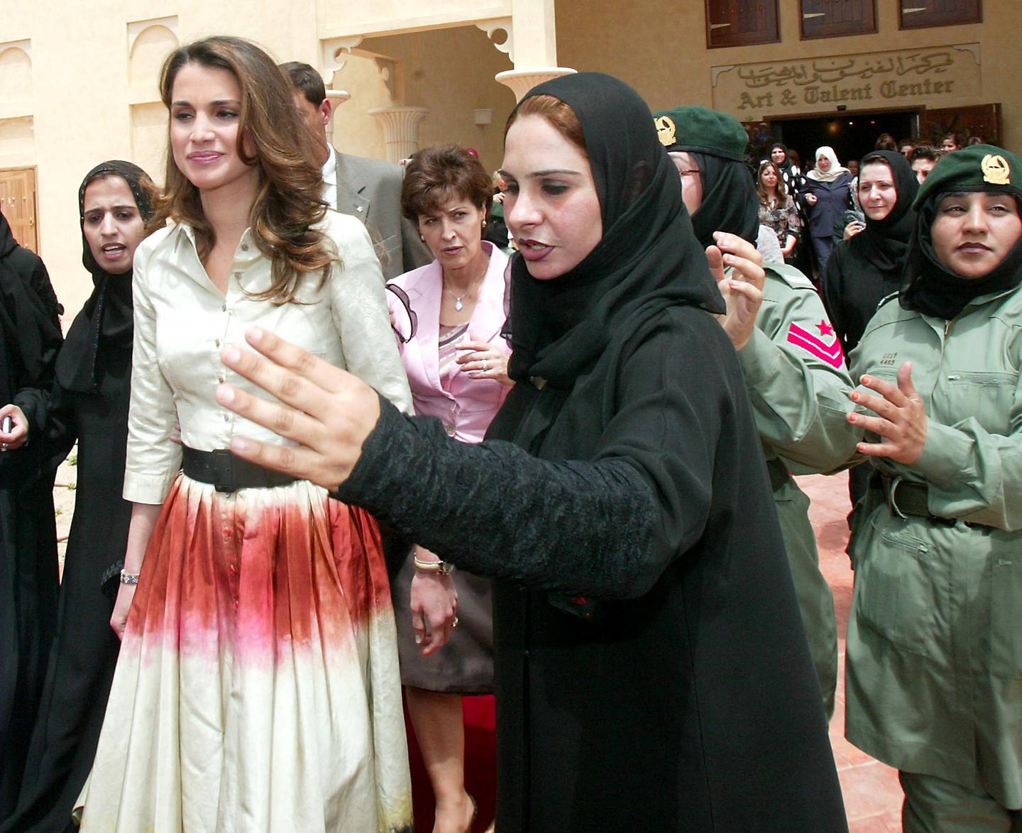 Queen Rania of Jordan is welcomed at the Dubai Ladies Club on April  7, 2004. AFP 