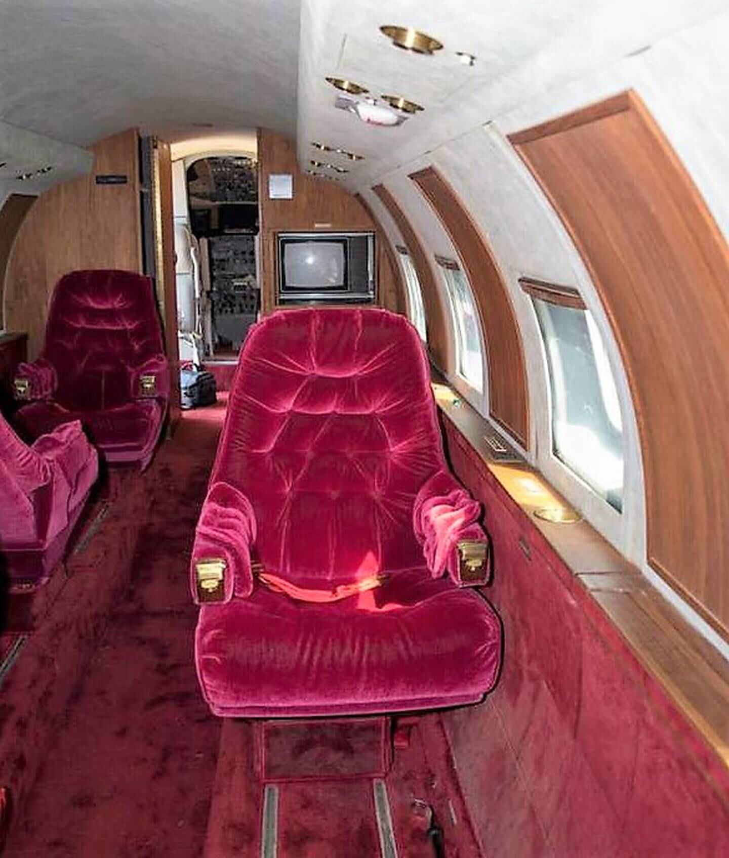 The interior has red velvet seats and original wood panelling details. Photo: GWS Auctions