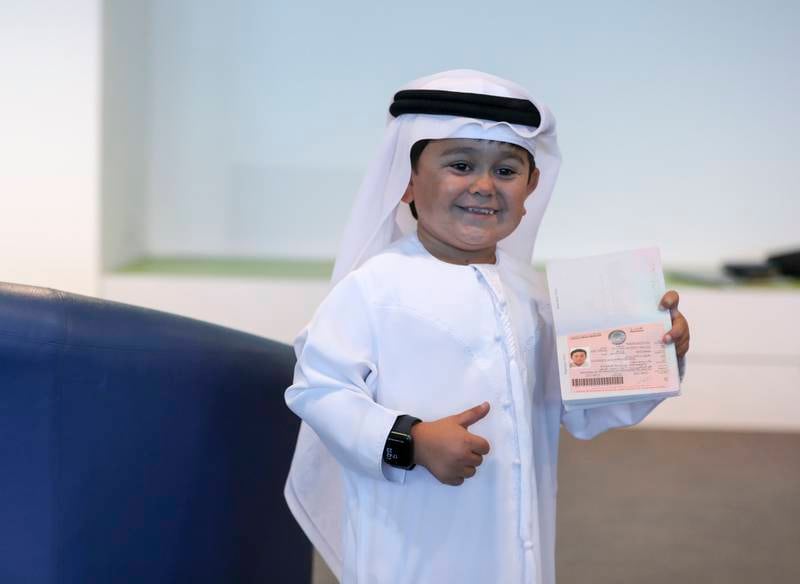 Rozik with his UAE golden visa in Abu Dhabi. Khusnum Bhandari / The National 
