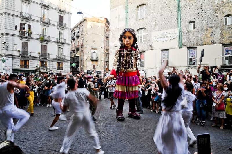 Dancers perform with Little Amal in Naples. EPA