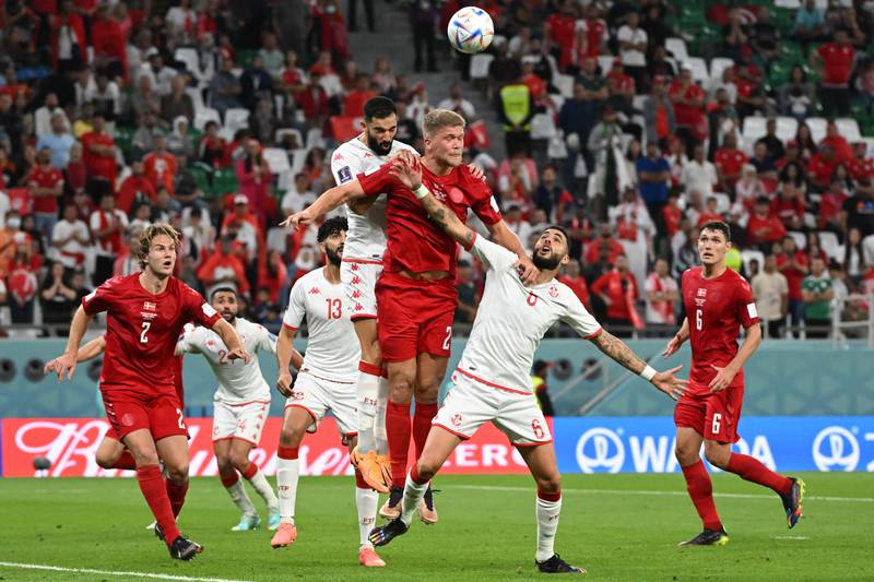 Denmark forward Andreas Cornelius heads the ball during the match. AFP