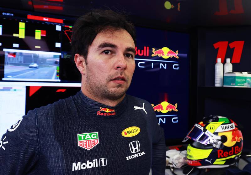 BAHRAIN, BAHRAIN - MARCH 13: Sergio Perez of Mexico and Red Bull Racing looks on in the garage during Day Two of F1 Testing at Bahrain International Circuit on March 13, 2021 in Bahrain, Bahrain. (Photo by Mark Thompson/Getty Images)