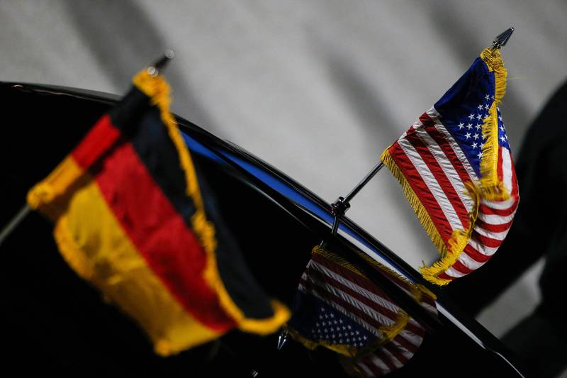 German and US flags on a car that will transport Ms Harris from the airport. AFP