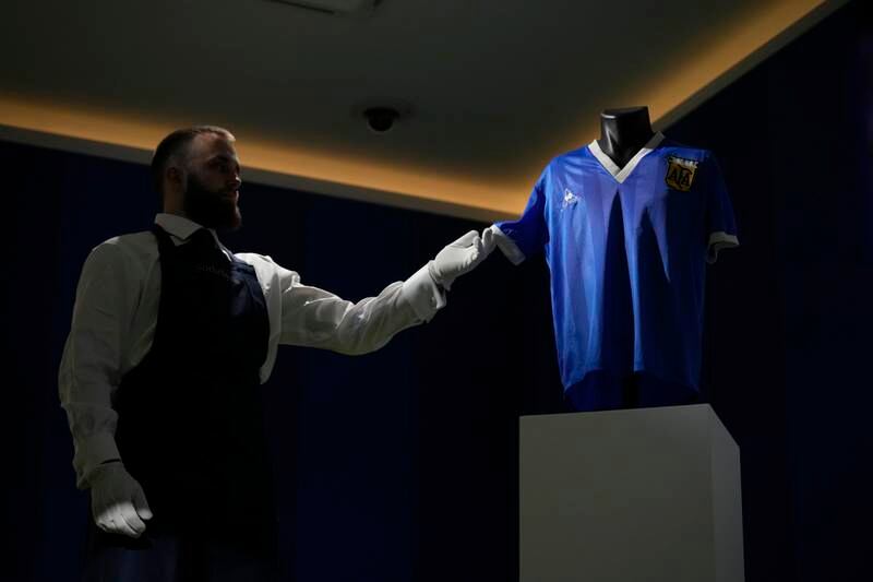 The Argentina football shirt worn by Diego Maradona during the 1986 Mexico World Cup quarter-final against England is displayed at Sotheby's auction house on April 20, 2022. AP