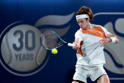 Russia's Andrey Rublev returns the ball to Poland's Hubert Hurkacz during their semi-final match of the Dubai Duty Free Tennis Championship on Friday, February 25, 2022.  AP Photo 
