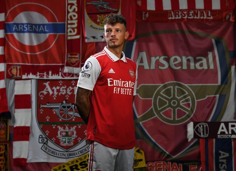 Arsenal's Ben White on a backdrop of flags. 