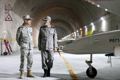 Iranian state media revealed the existence of a drone base, said to be in the Zagros Mountains, in reports on a visit  to the facility by Maj Gen Mohammad Bagheri, left, Iran's Armed Forces Chief of Staff.  Reuters