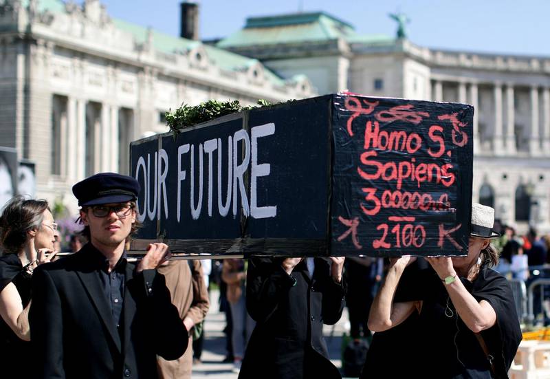 Climate change activists participate in a funeral march during the Extinction Rebellion protest in Vienna. Reuters