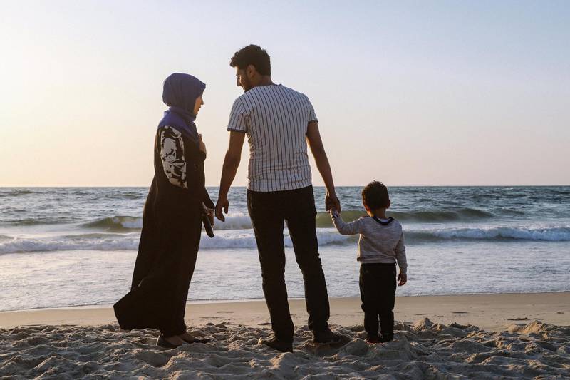 Hosan Horami, his wife and his son on the beach of Gaza City, June 5, 2018. Wilson Fache for The National