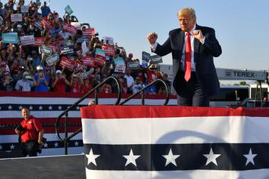 US President Donald Trump dances as he leaves a rally in Tucson, Arizona, an event at which he said people were tired of hearing about the pandemic. AFP 