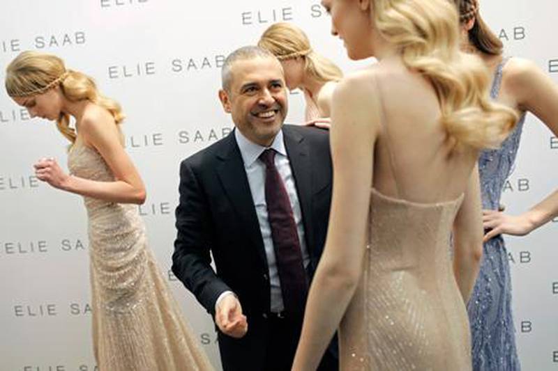 Gowns made by the Lebanese fashion designer Elie Saab, seen with models after his Spring/Summer 2010 Haute Couture show in Paris, are in demand among A-list film stars for glamorous events. Thibault Camus / AP Photo