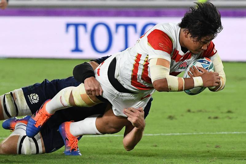 Japan prop Keita Inagaki scores his team's second try against Scotland. AFP