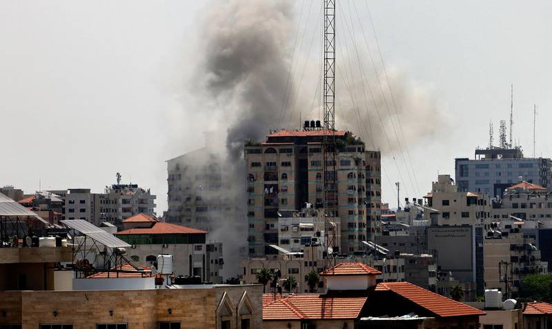 Smoke billows from a building targeted by an Israeli bombardment in Gaza City, on Tuesday. AFP