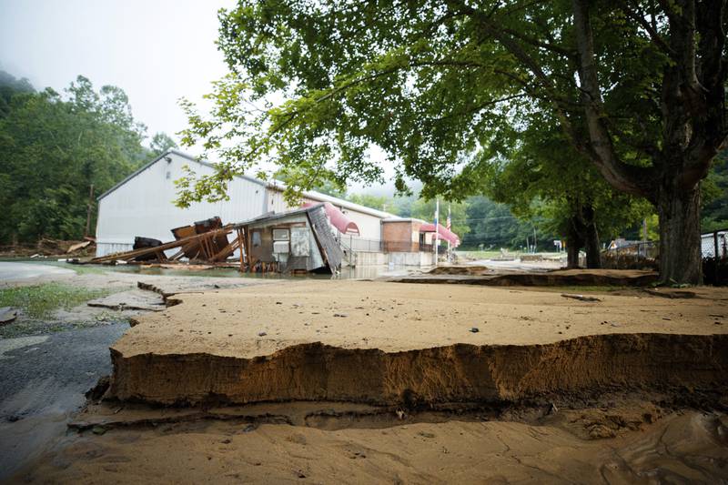 A thick layer of mud that was left behind after the flash flood. AP