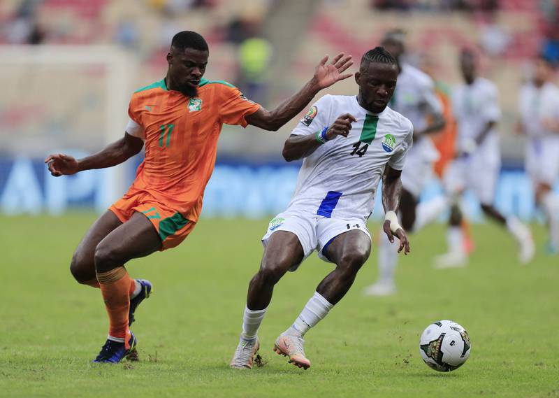 Mohamed Buya Turay, of Sierra Leone, turns away from Ivory Coast's Serge Aurier. Reuters