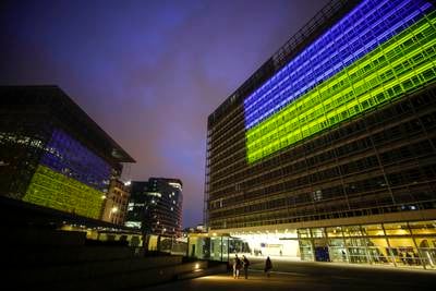 The EU Council and Commission buildings illuminated in the colours of the Ukrainian flag. EPA